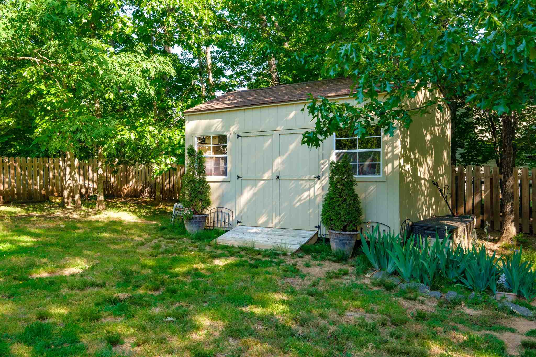 20 Brougham Road Palmyra, VA 22963 - Photo 38 of 44 a view of a small yard in front of a house with large tree and plants