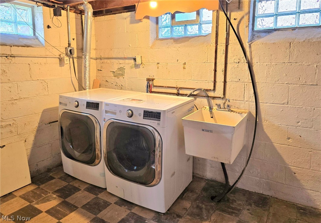 4111 Redfern Road Parma, OH 44134 - Photo 31 of 40 Laundry with washer, dryer and ulitity sink