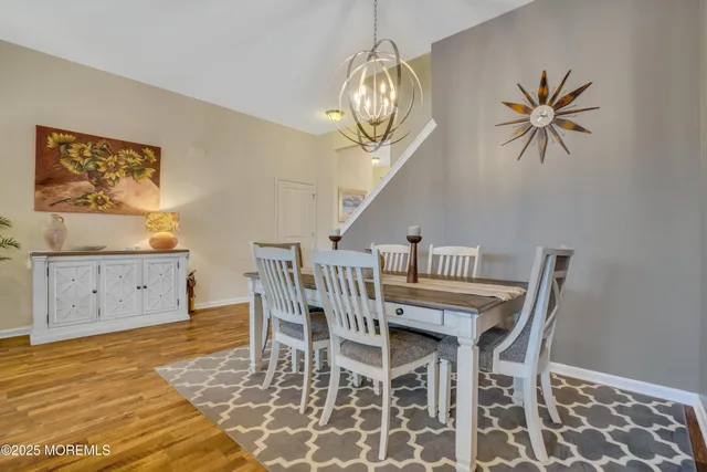 a living room with furniture a wooden floor and a fireplace
