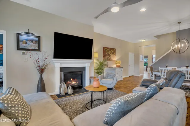 a kitchen with stainless steel appliances granite countertop a sink a refrigerator and a stove