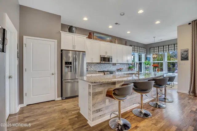 a view of a dining room with furniture window and outdoor kitchen