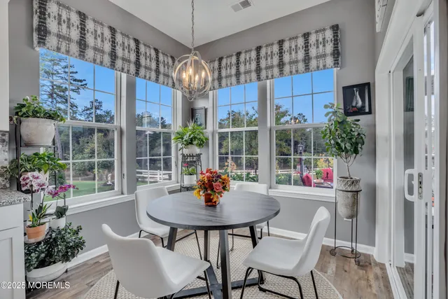 a large white kitchen with a stove and a sink