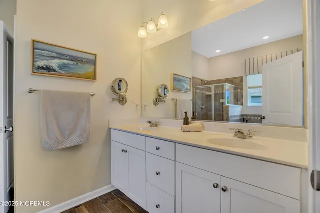 a bedroom with a bed and dresser with window