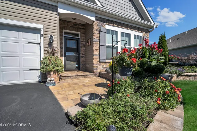 a view of a room with furniture and wooden floor