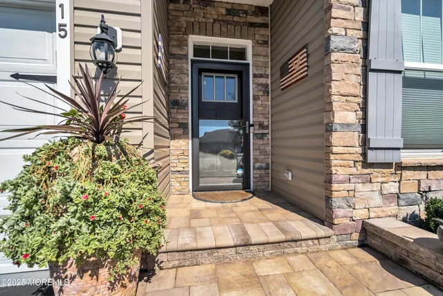 a view of a livingroom with wooden floor and furniture