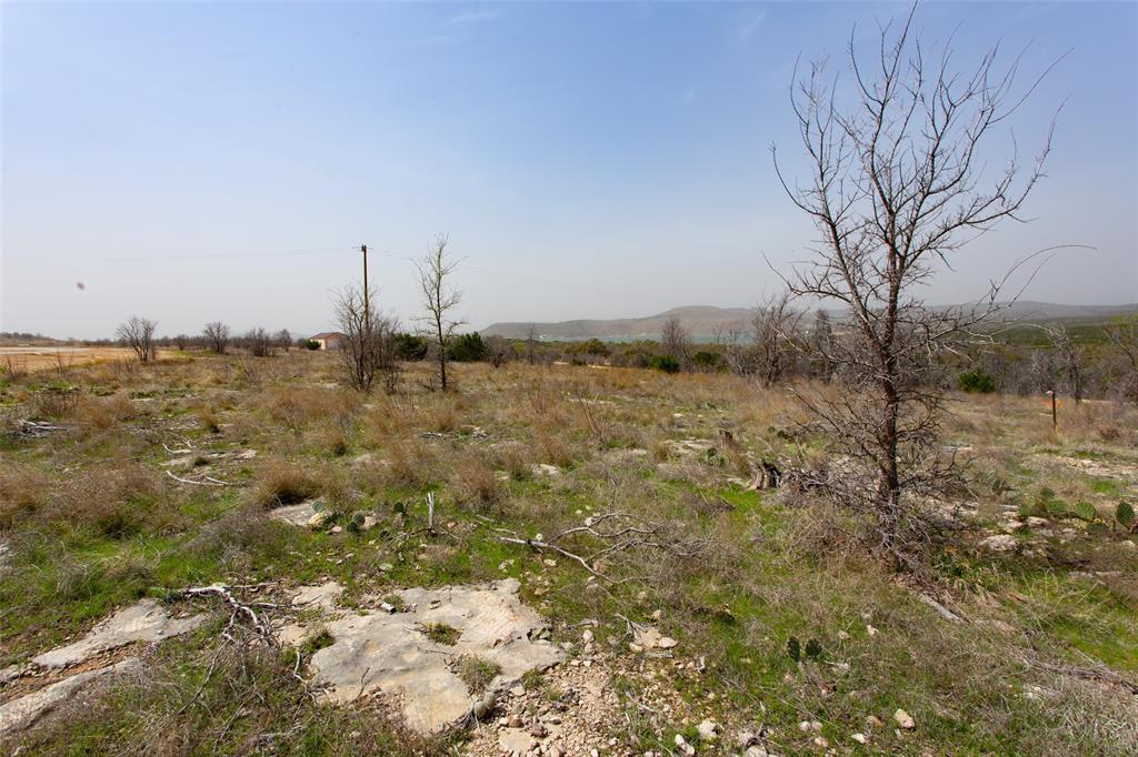 121 White Moon Road Graham, TX 76450 - Photo 7 of 9 a view of a dry yard with wooden fence