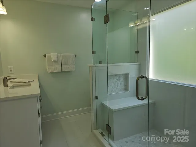 a bedroom with bed and a window