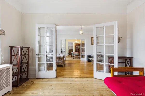 a view of living room filled with furniture and wooden floor