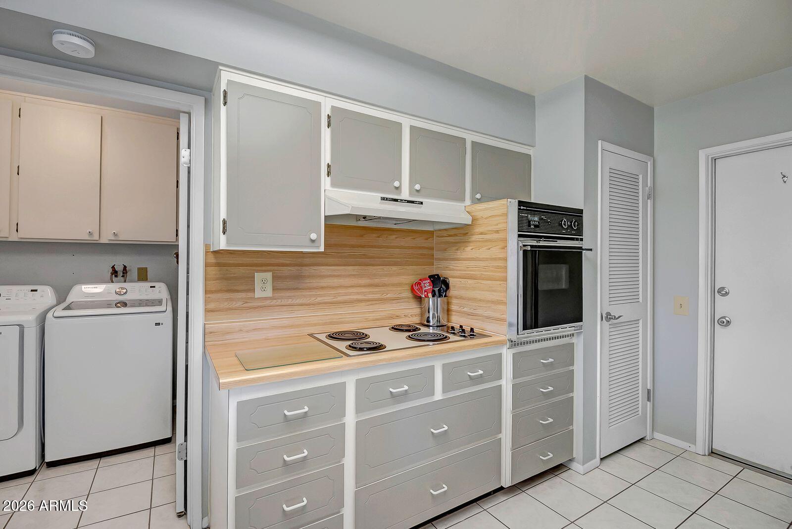 9613 West Oak Ridge Drive Sun City, AZ 85351 - Photo 13 of 31 sc - kitchen laundry