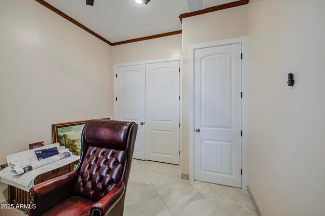 a room with furniture a couch and a dresser with wooden floor