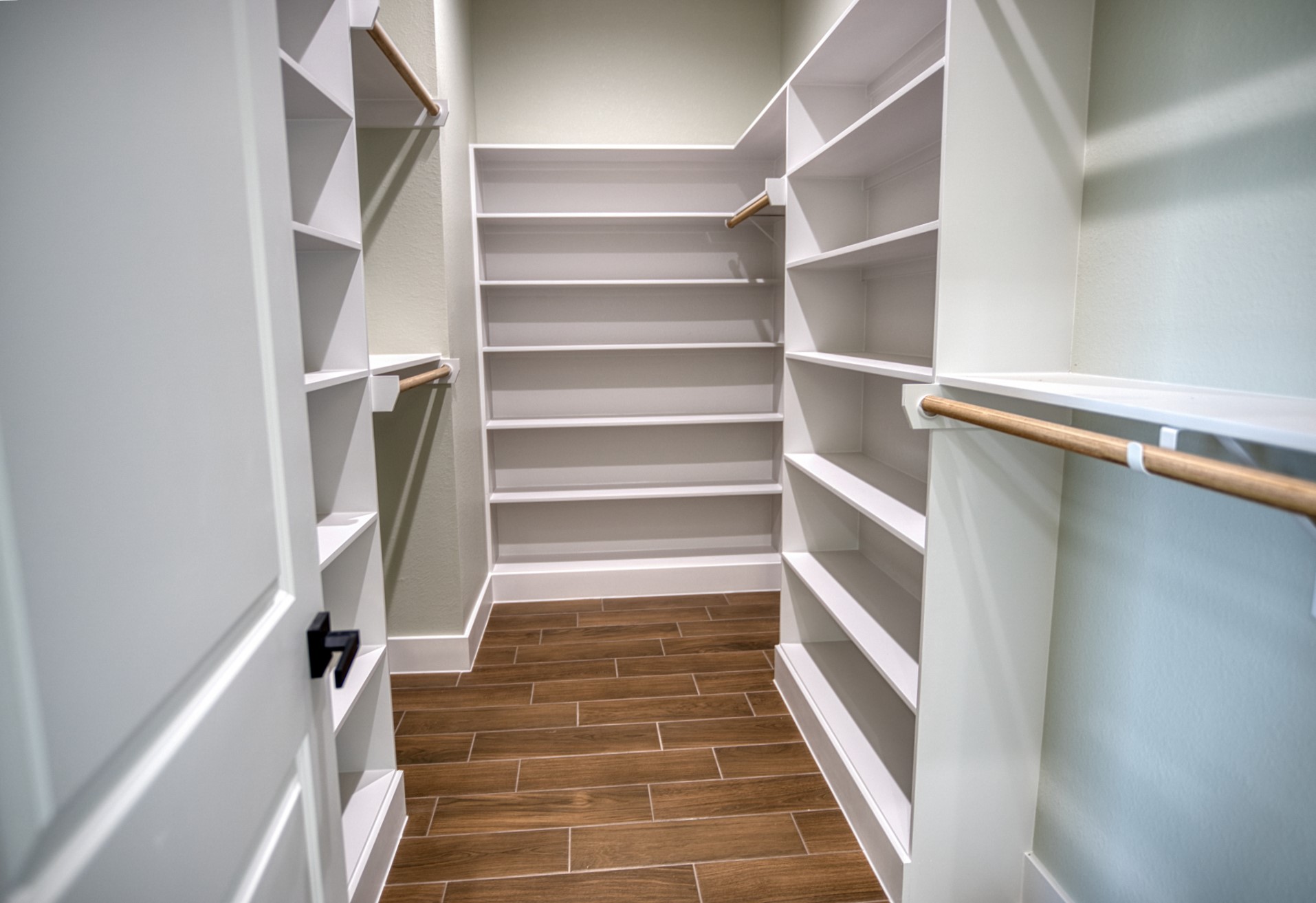 925 Buffalo Trail Angleton, TX 77515 - Photo 31 of 45 a view of walk in closet with empty racks