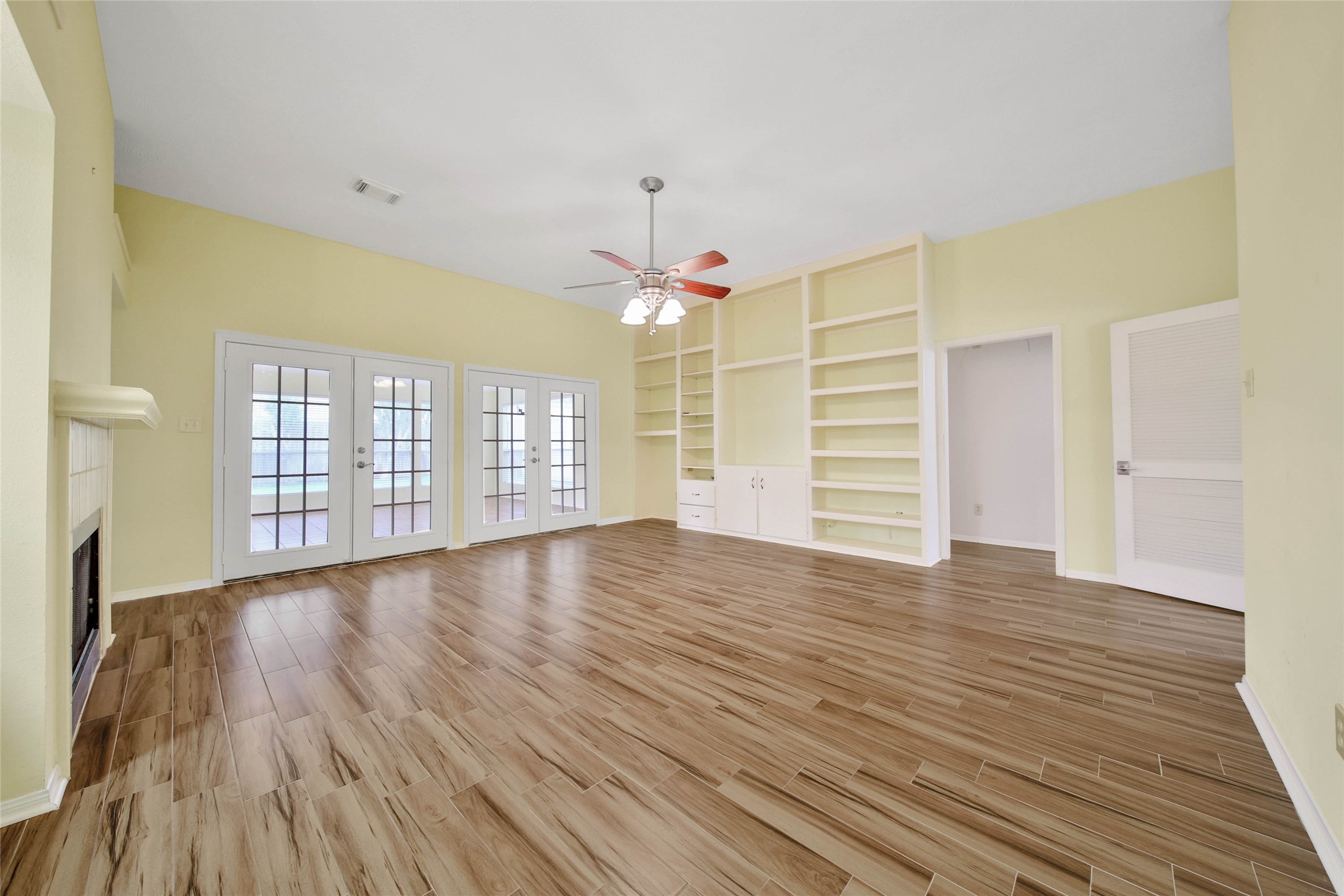 5010 Cupids Bower Court Spring, TX 77388 - Photo 8 of 40 a view of an empty room with a window and wooden floor
