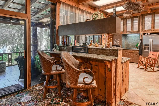 a view of a swimming pool with a patio and a yard