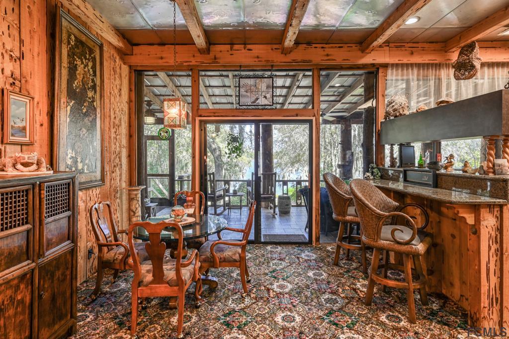 375-397 Southeast County Road Starke, FL 32091 - Photo 19 of 75 a view of a chairs and table in a patio