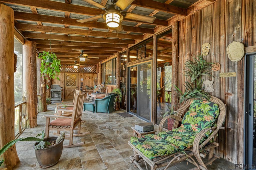 375-397 Southeast County Road Starke, FL 32091 - Photo 23 of 75 a view of a chairs and table in a patio