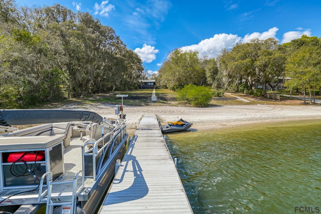 375-397 Southeast County Road Starke, FL 32091 - Photo 29 of 75 a view of a swimming pool with a patio and a yard