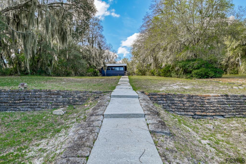 375-397 Southeast County Road Starke, FL 32091 - Photo 30 of 75 a front view of a house with a yard