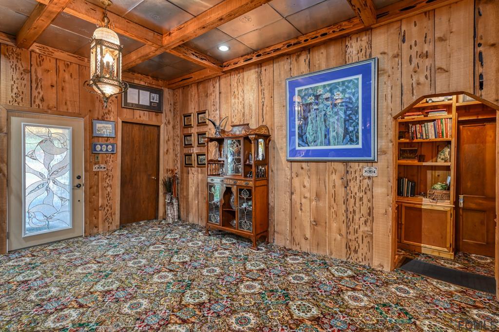375-397 Southeast County Road Starke, FL 32091 - Photo 36 of 75 a view of a hallway with wooden shelves