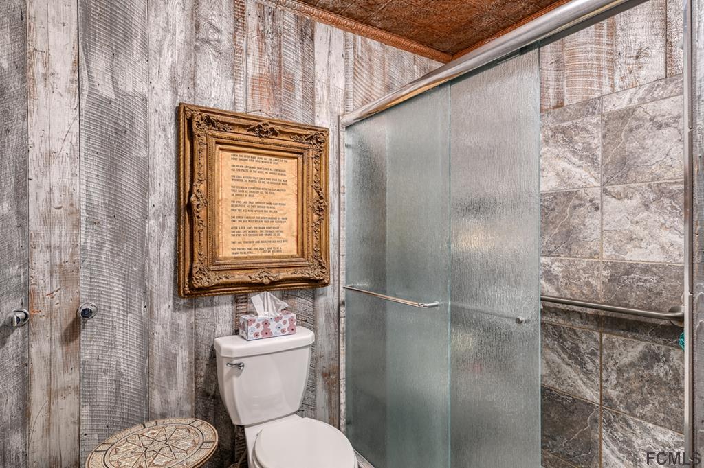 375-397 Southeast County Road Starke, FL 32091 - Photo 41 of 75 a bathroom with a toilet and a shower