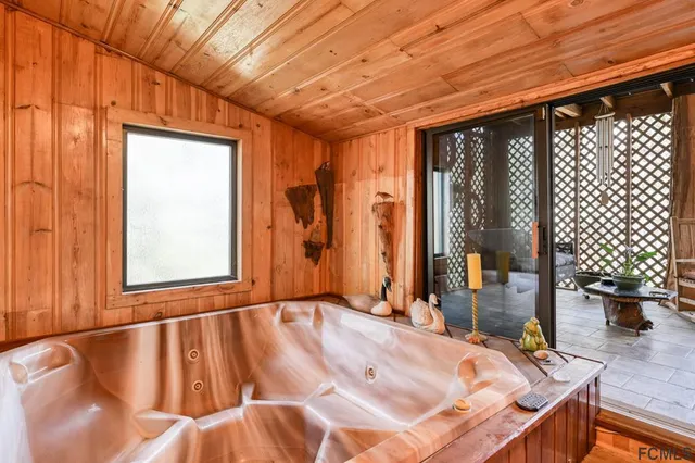 a view of front door with furniture and a window