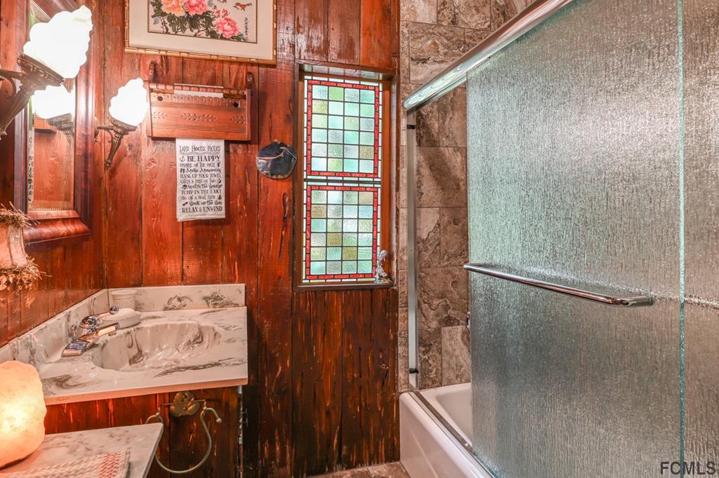375-397 Southeast County Road Starke, FL 32091 - Photo 51 of 75 a bathroom with a bathtub and shower