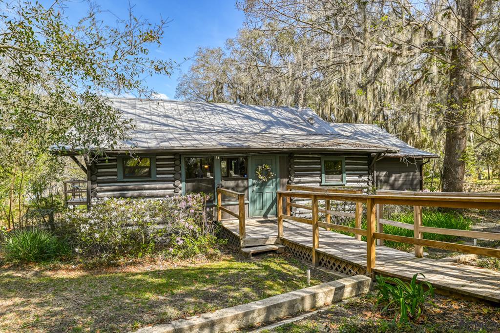 375-397 Southeast County Road Starke, FL 32091 - Photo 54 of 75 a view of a house with backyard porch and sitting area