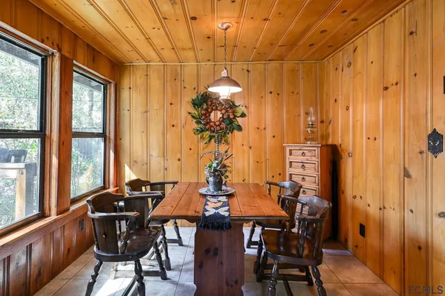 a view of a chair and table in the patio and a fire pit