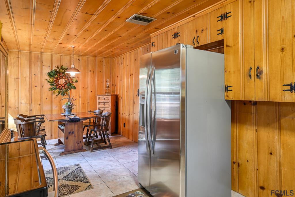 375-397 Southeast County Road Starke, FL 32091 - Photo 57 of 75 a kitchen with stainless steel appliances a refrigerator and cabinets