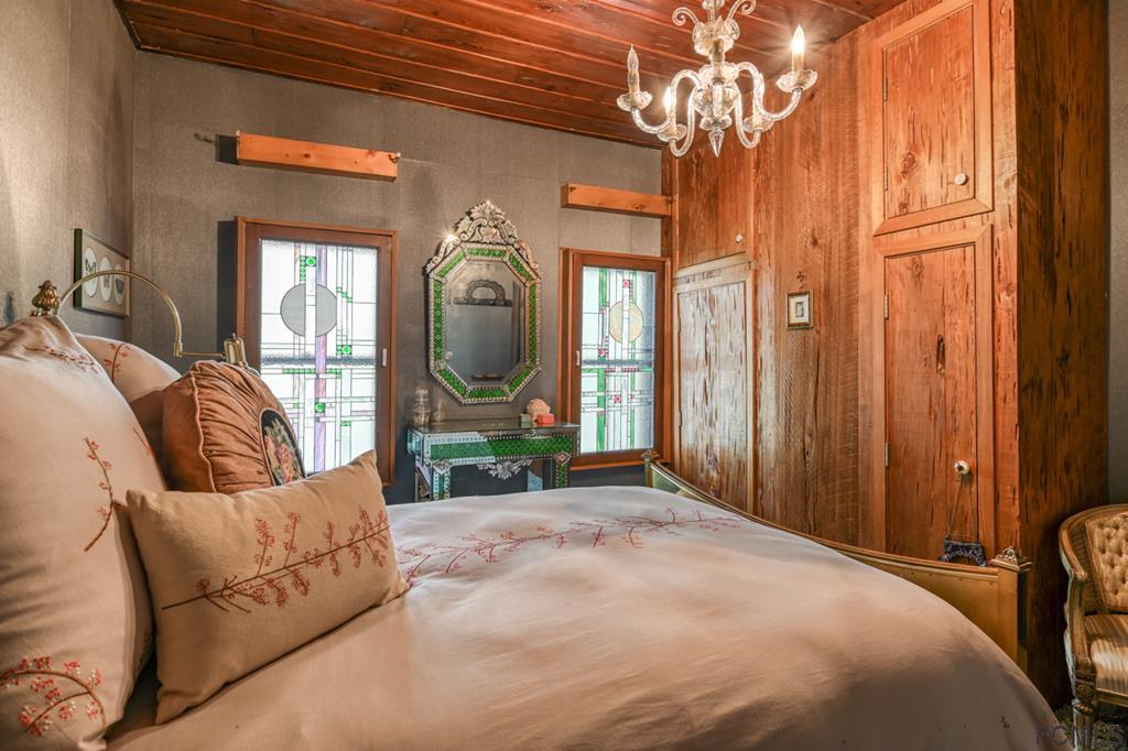 375-397 Southeast County Road Starke, FL 32091 - Photo 60 of 75 a bed room with a bed mirror and a window