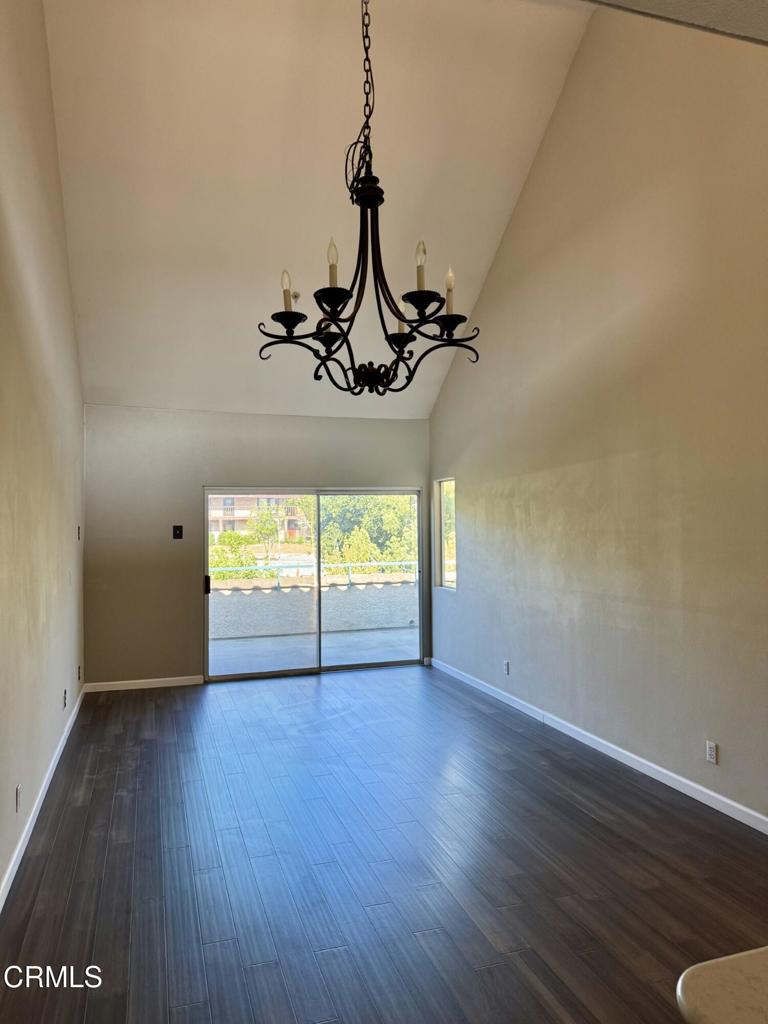 2742 Borchard Road Newbury Park, CA 91320 - Photo 12 of 51 a view of an empty room with wooden floor and a window