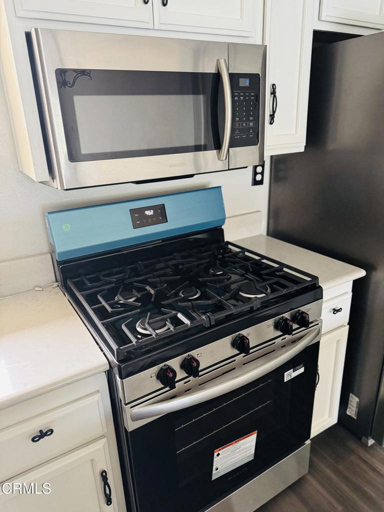 2742 Borchard Road Newbury Park, CA 91320 - Photo 17 of 51 a stove top oven sitting inside of a kitchen