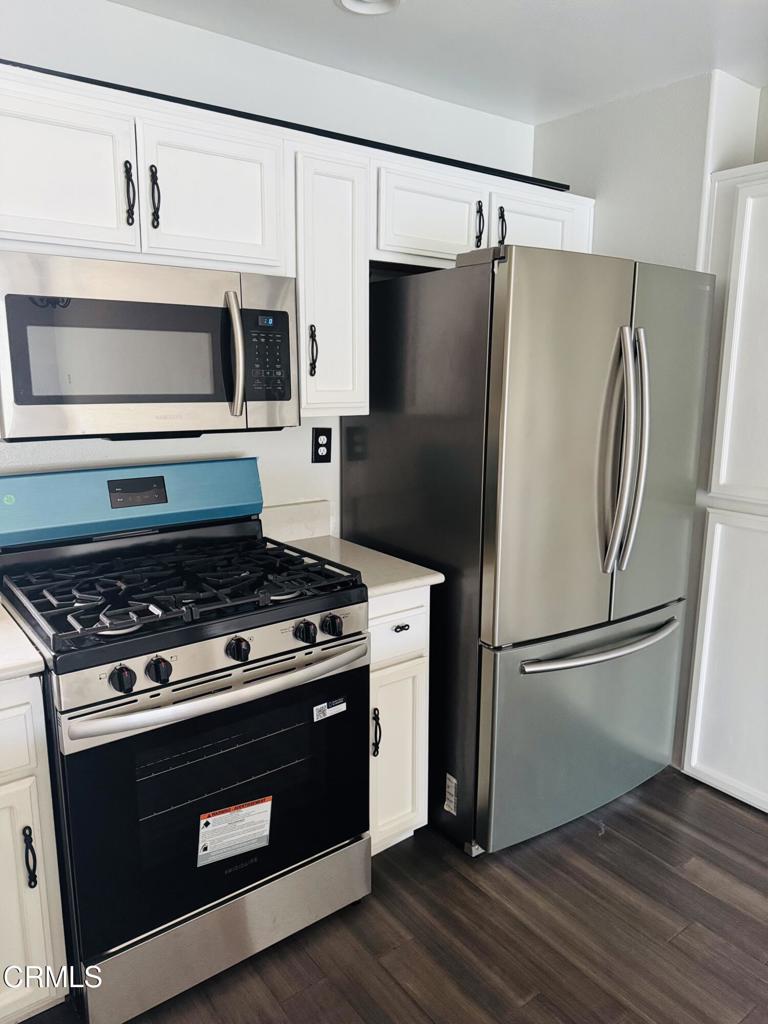 2742 Borchard Road Newbury Park, CA 91320 - Photo 18 of 51 a stove top oven sitting inside of a kitchen