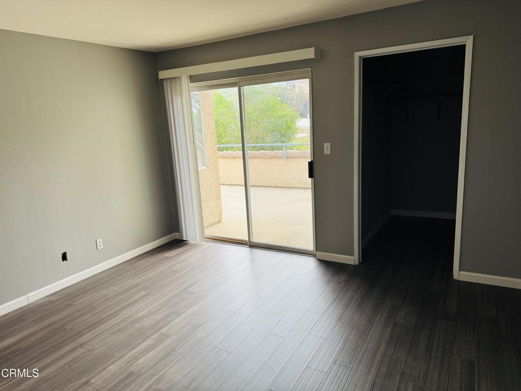 2742 Borchard Road Newbury Park, CA 91320 - Photo 26 of 51 a view of an empty room with wooden floor and a window