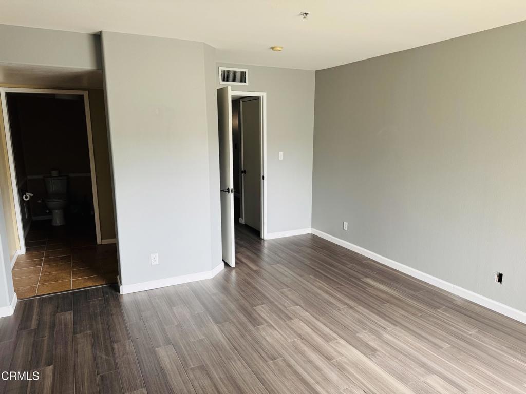 2742 Borchard Road Newbury Park, CA 91320 - Photo 27 of 51 a view of an empty room with wooden floor and closet
