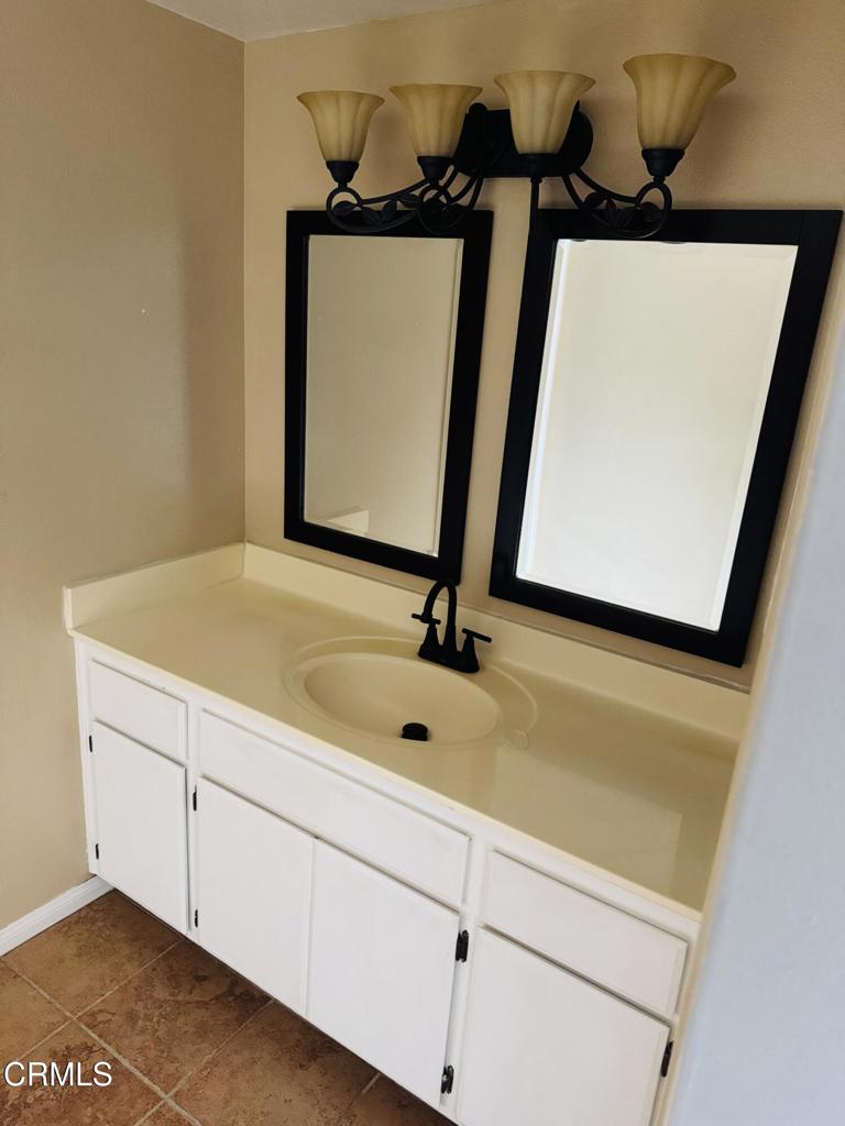 2742 Borchard Road Newbury Park, CA 91320 - Photo 31 of 51 a bathroom with a sink and mirror