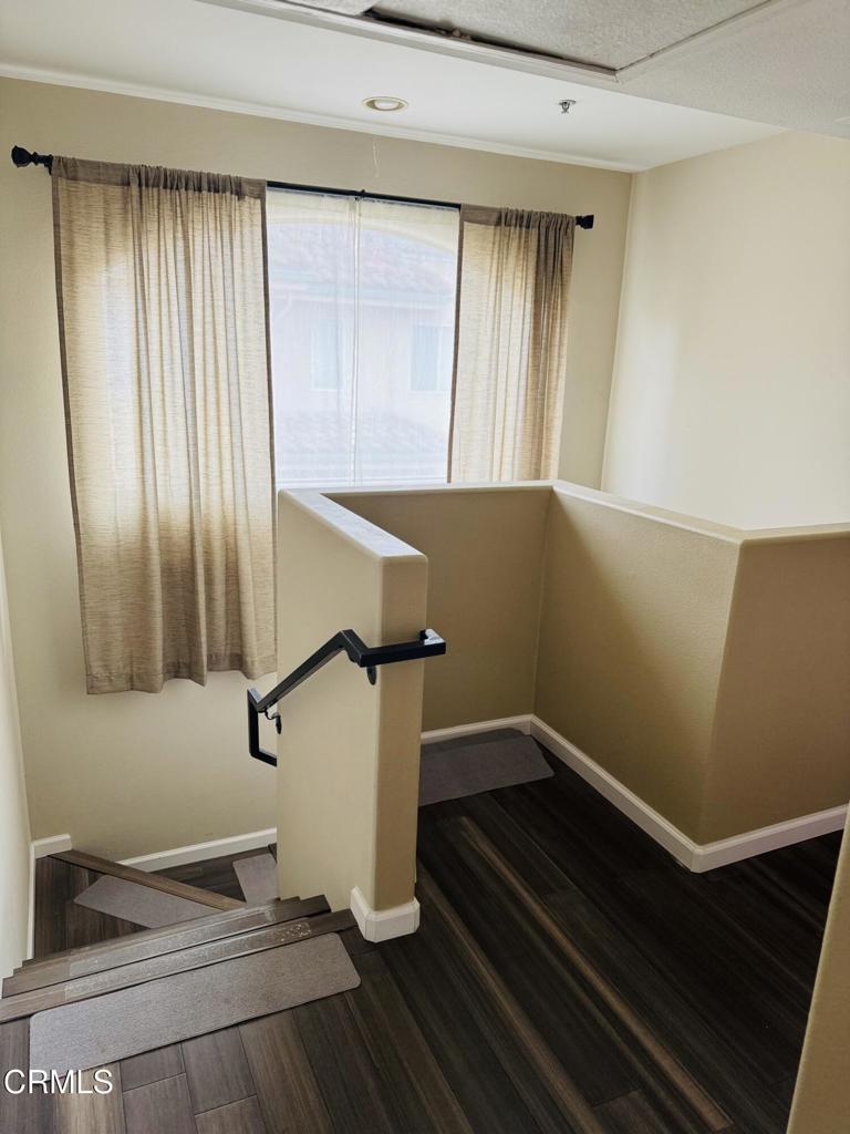 2742 Borchard Road Newbury Park, CA 91320 - Photo 32 of 51 a view of an empty room with wooden floor and a window