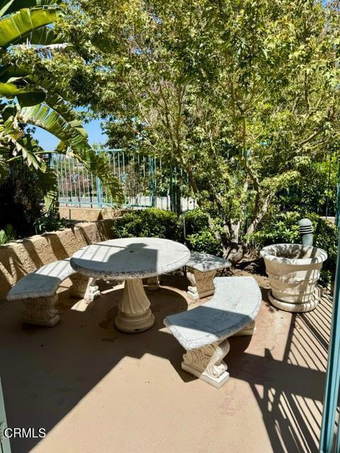 2742 Borchard Road Newbury Park, CA 91320 - Photo 46 of 51 a view of a patio with table and chairs with wooden fence and plants