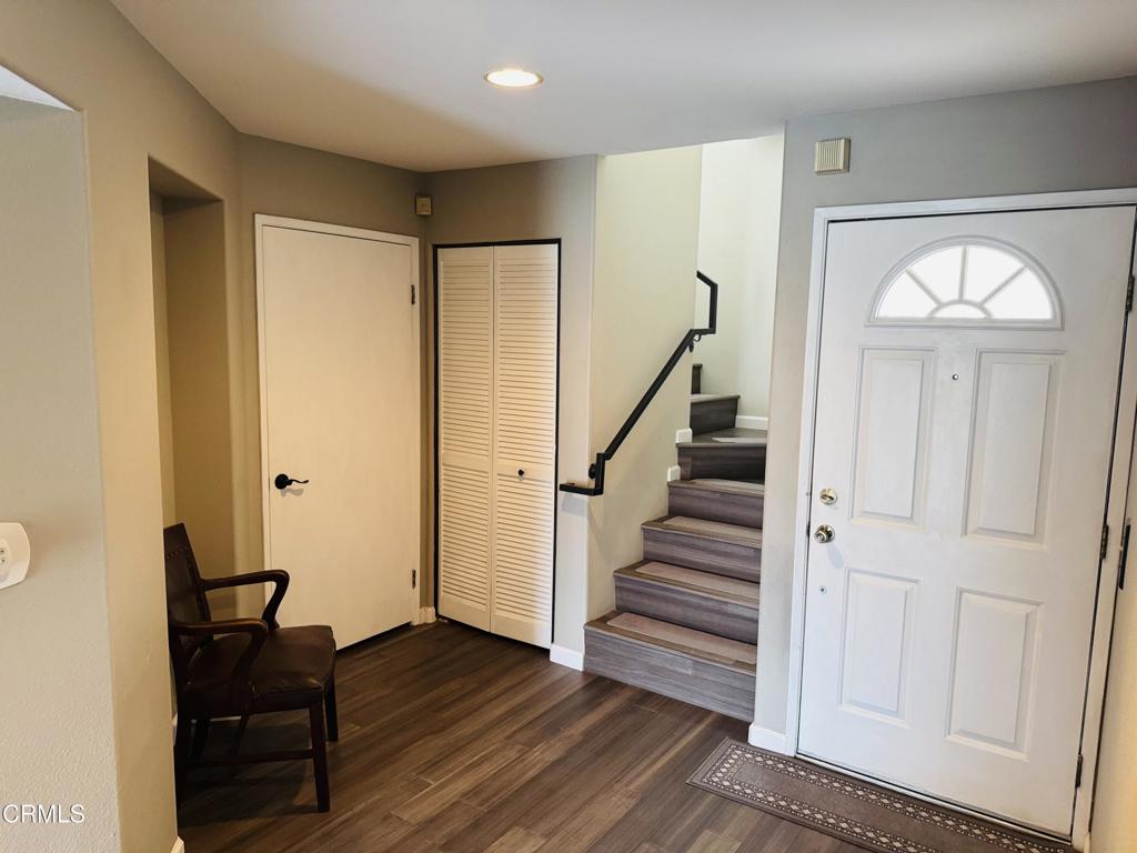 2742 Borchard Road Newbury Park, CA 91320 - Photo 10 of 51 a view of a hallway with wooden floor and workspace