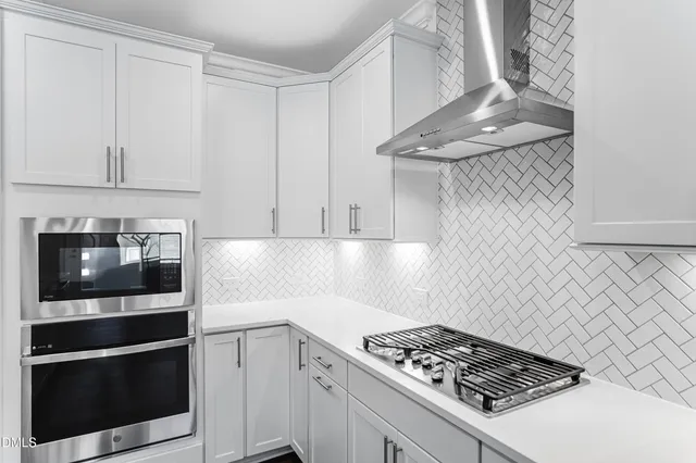 a kitchen with cabinets and a stove