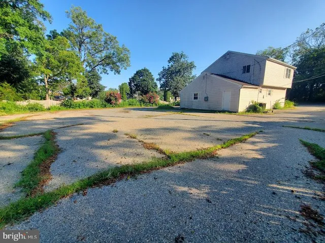 a view of a house with a yard and a garage