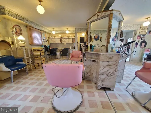 a living room with furniture a rug and a fireplace