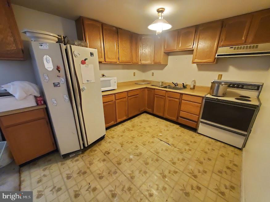 108 Juliustown Road Browns Mills, NJ 08015 - Photo 5 of 19 a kitchen with sink refrigerator and cabinets