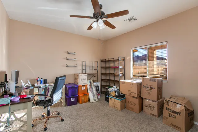 a view of a workspace with furniture