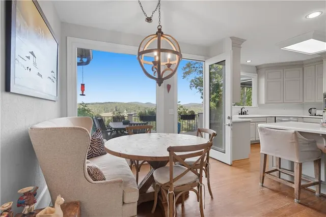 a bathroom with a granite countertop toilet sink and mirror