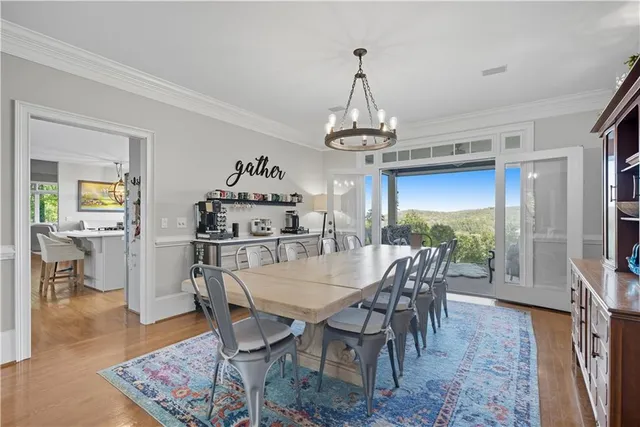 a view of a roof deck with furniture