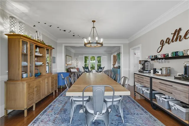a living room with fireplace furniture and a large window