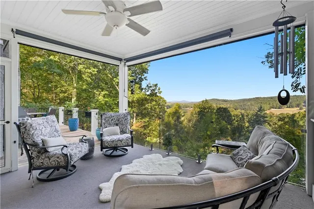 a living room with furniture fireplace and a flat screen tv
