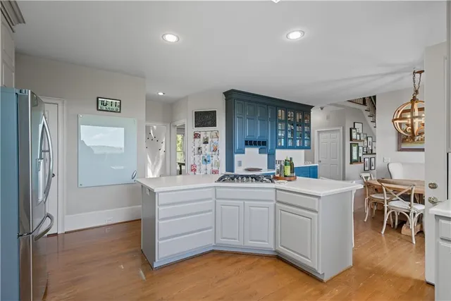 a large white bed in a white room