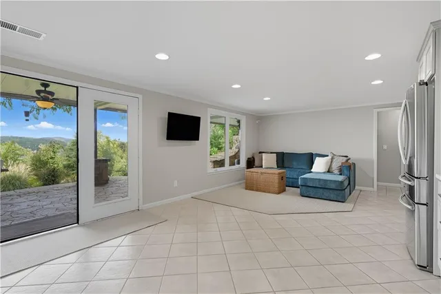 a view of a patio with chairs and plants