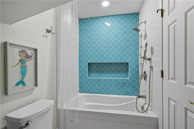 a kitchen with stainless steel appliances a refrigerator sink and cabinets